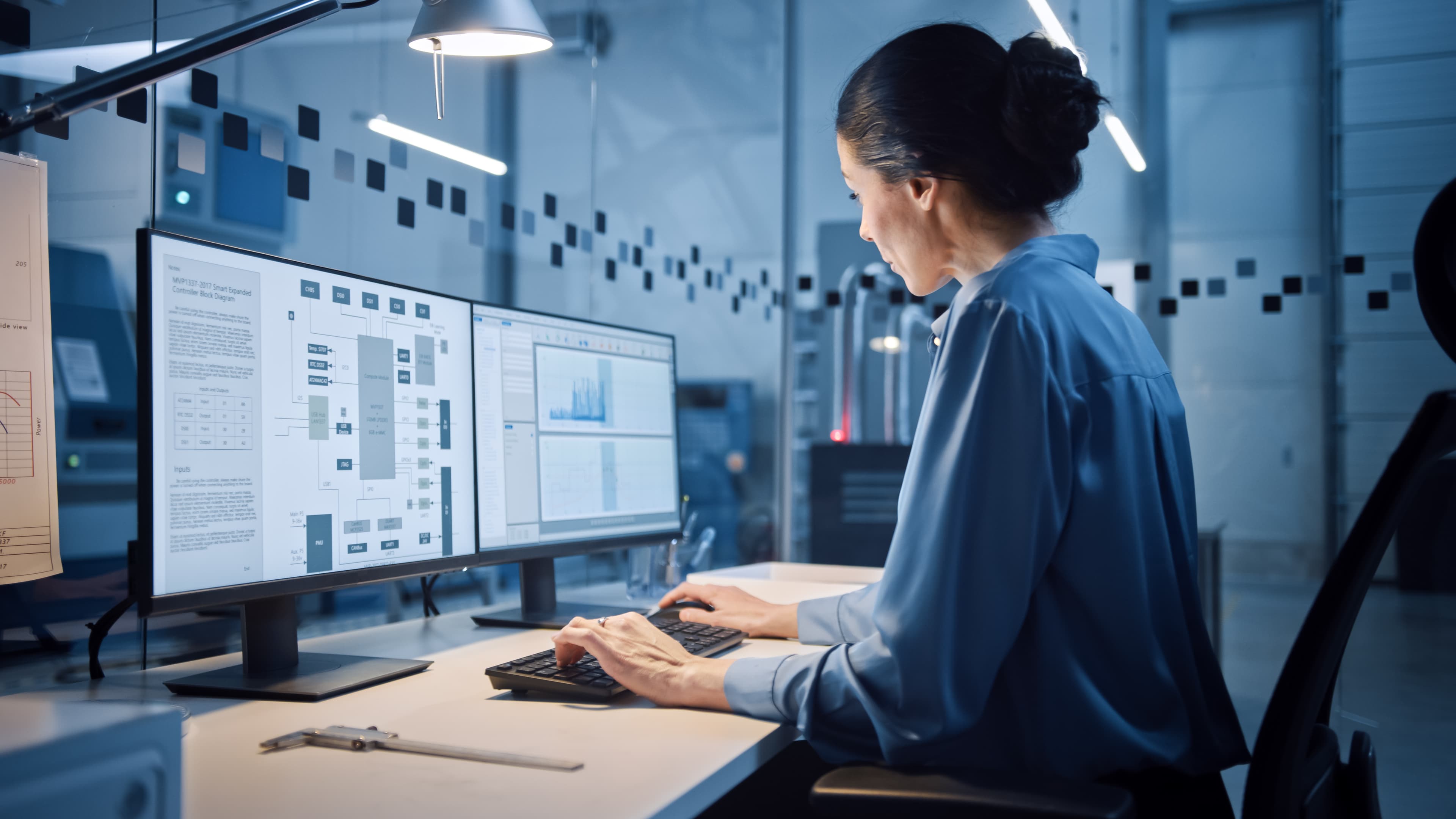 Woman working on a laptop in a modern office